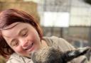 Farm ranger Gina Hulme with one of the lambs at the community farm