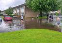 The flooded road in Wharton Gardens, Winsford