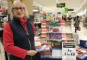 Hilary Edwards-Malam of the Friends of Winsford Town Park, with the Winsford 2024 calendar in Asda, Winsford