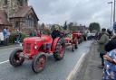 Crowds line the streets in Appleton Thorn to watch the tractor run