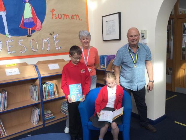 Northwich Guardian: Rupert Adams delivering dictionaries to Leftwich Community Primary School where students Bethany and Matthew, along with their librarian teacher Mrs Akers