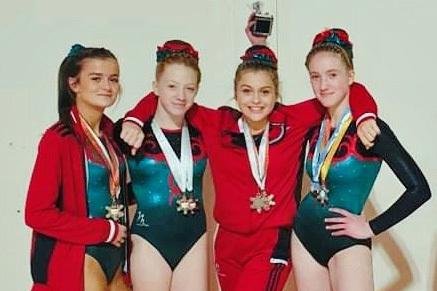 Teens Freya Jackson, Erin Frost, Scarlett Kay, all aged 15, and Livia Janciuke, 14, who also gained overall champion in her category