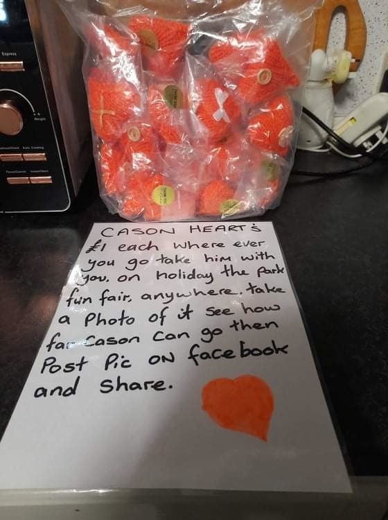 Tiny knitted orange hearts are being sold to remember Cason all over the world