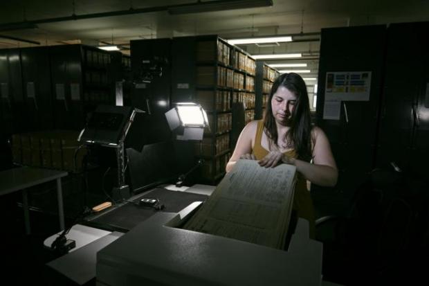 Northwich Guardian: Photo via PA shows Findmypast technician Laura Gowing scans individual pages of the 30,000 volumes of the 1921 Census at the Office for National Statistics (ONS) near Southampton.