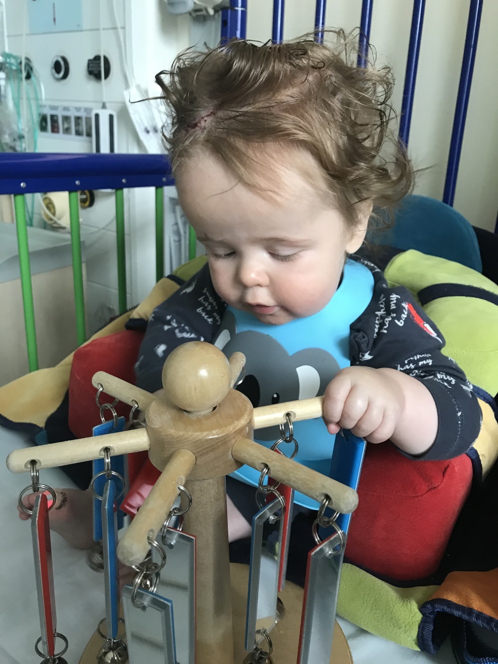 Joseph playing with toys in hospital