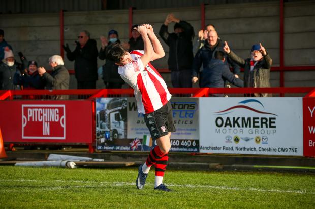 Northwich Guardian: Callum Saunders celebrates his goal with a tee shot. Picture: Karl Brooks Photography