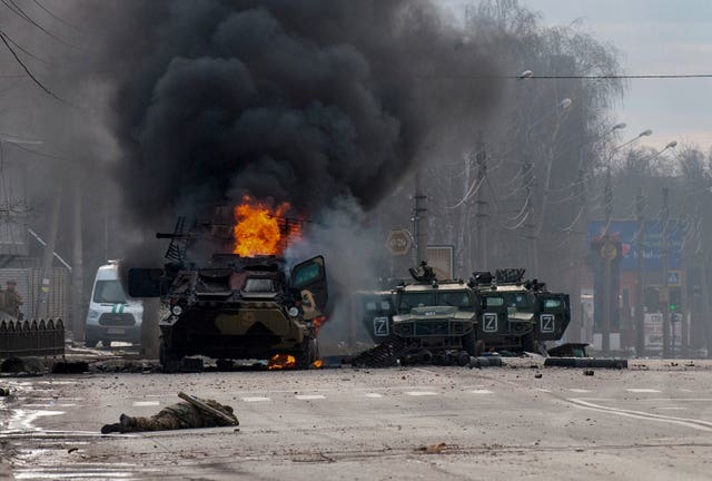 Troops engaged in street fighting in Kharkiv, Ukraine, on Sunday (Marienko Andrew/AP)