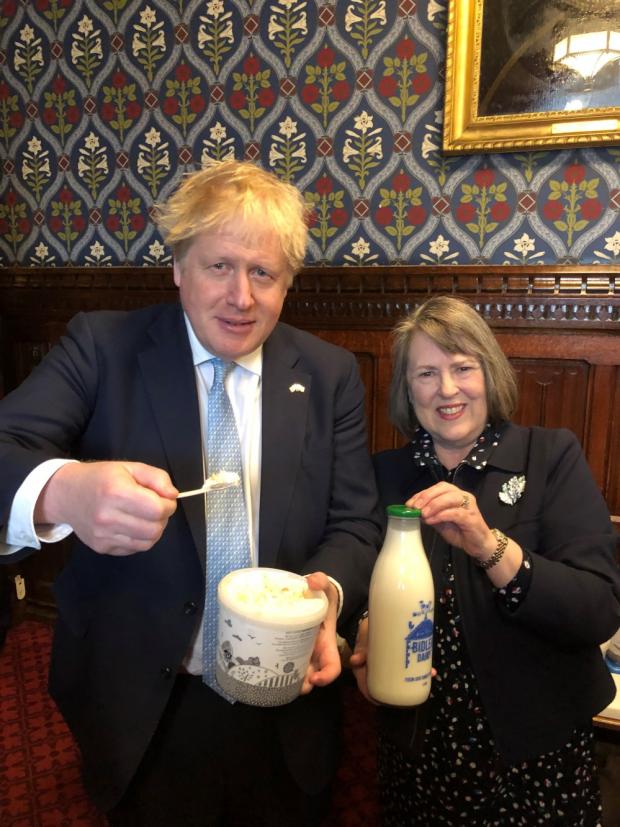 Northwich Guardian: Boris Johnson and Fiona Bruce MP who invited Bidlea Dairy to showcase their products in the Houses of Parliament