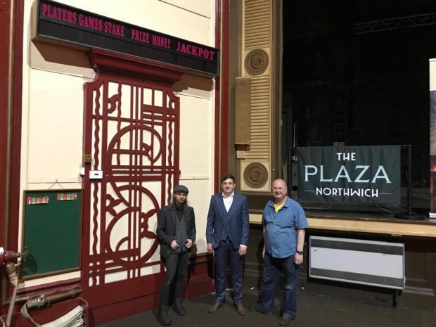 Northwich Guardian: Kyrian Smith (bar manager) Jon Houghton (venue manager) and Rupert Adams (Northwich Rotary) by the stage at the iconic venue with the old electronic bingo board still in situ