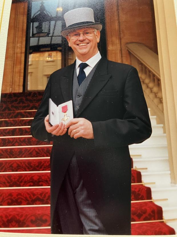 Northwich Guardian: Stan Mendham receiving the OBE at Buckingham Palace