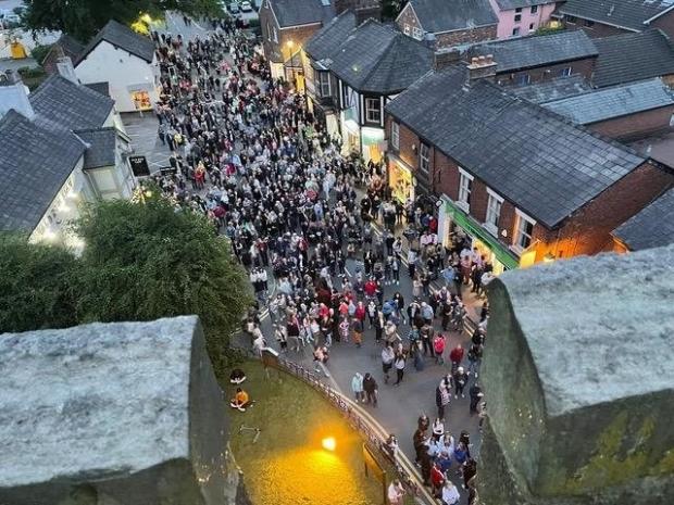 Northwich Guardian: Crowds gathered in Holmes Chapel to watch a beacon being lit Picture: Karoline Peach
