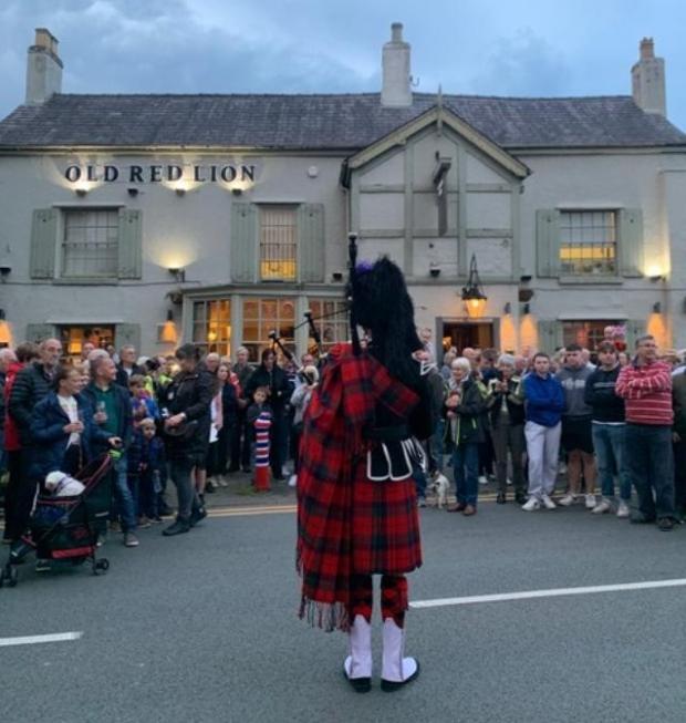 Northwich Guardian: A bugler heralds the start of the celebrations in Holmes Chapel Picture: Karoline Peach
