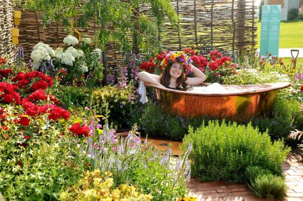 Northwich Guardian: A model cools off in a bath at last year's RHS Flower Show at Tatton