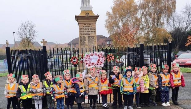 Northwich Guardian: Children made a wreath out of handprints for Remembrance Sunday