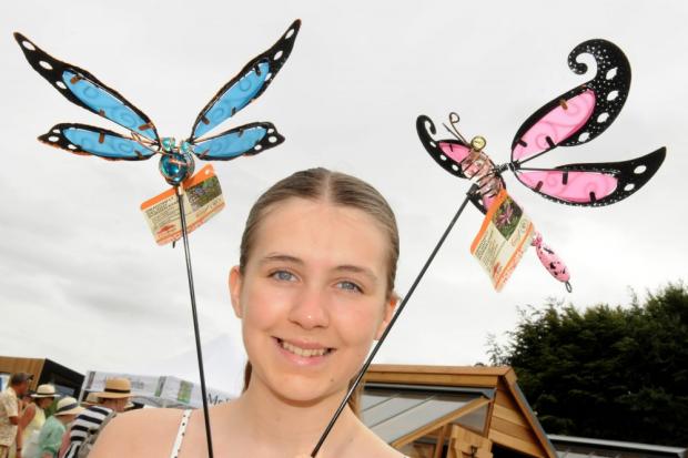 Northwich Guardian: Lily Brown was delighted to find these colourful dragonflies at the RHS Tatton Flower Show to decorate her garden at home