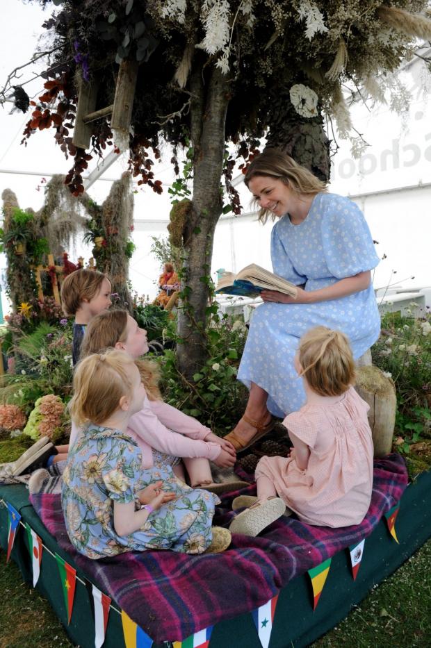 Northwich Guardian: Mum Faye Parker reads Enid Blyton's The Faraway Tree to daughters Lydia, Felicity and Dotty and their cousin Barnie Terry