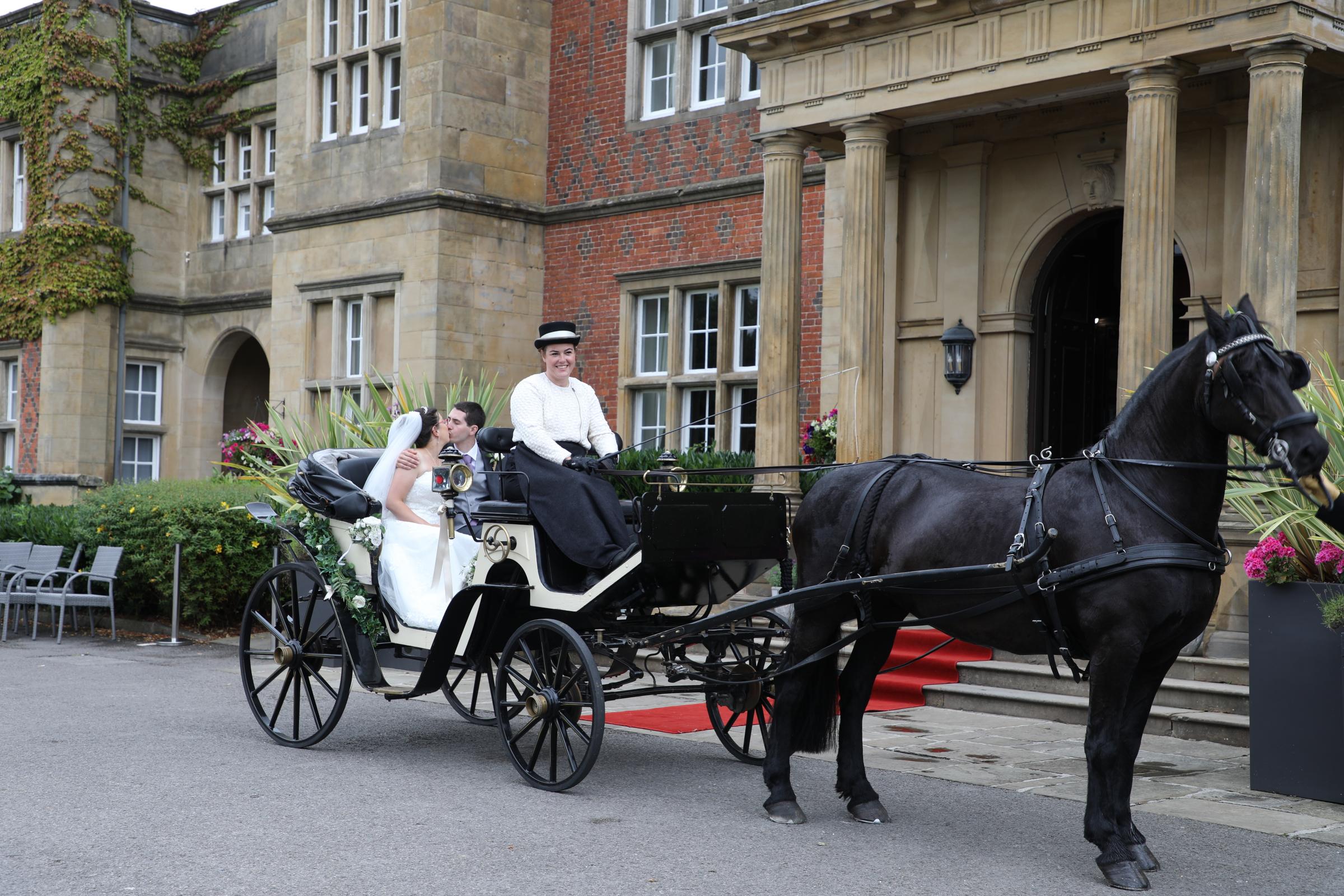The happy couple arriving in style at Cranage Hall