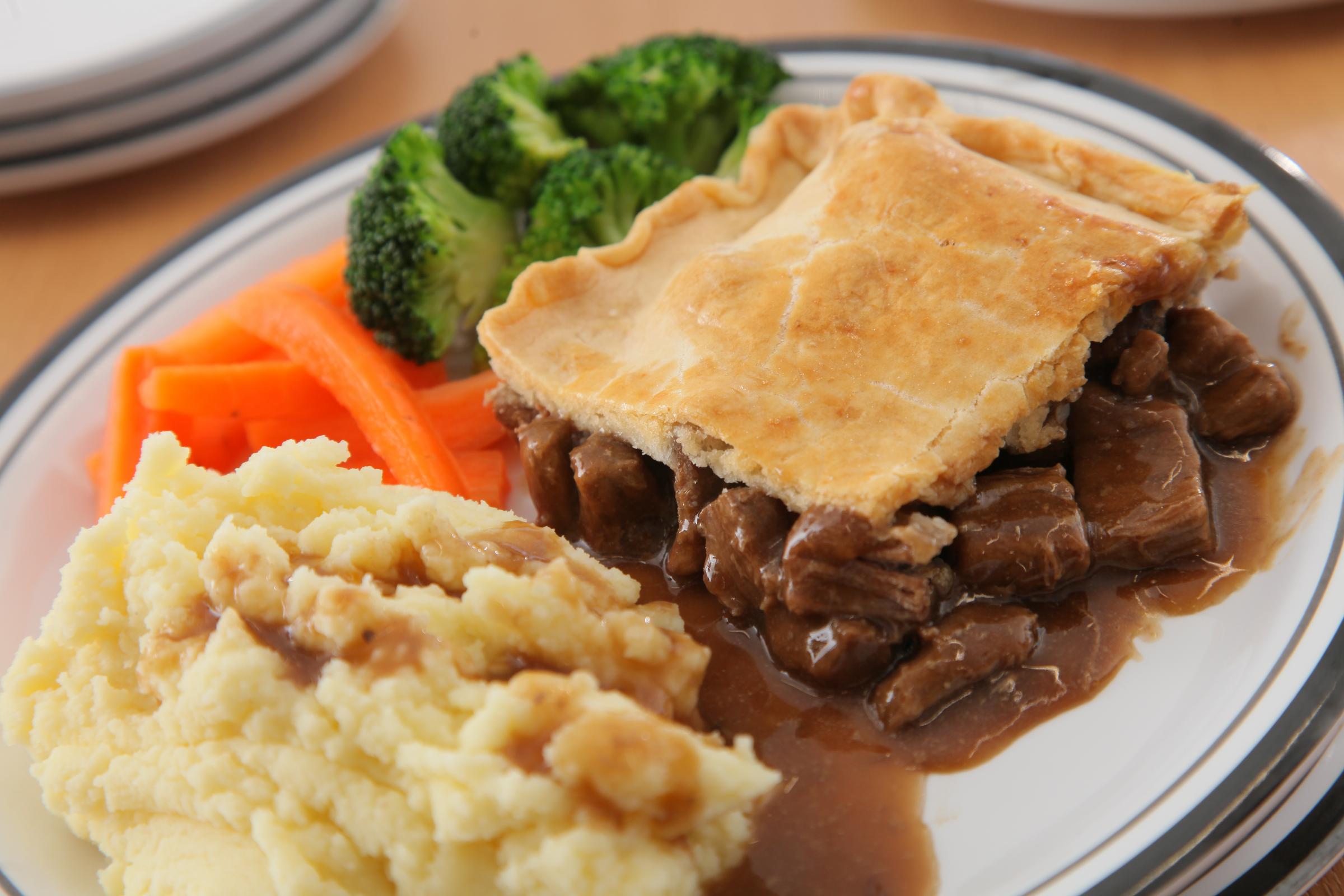 Beef pie with creamy mashed potato and fresh vegetables