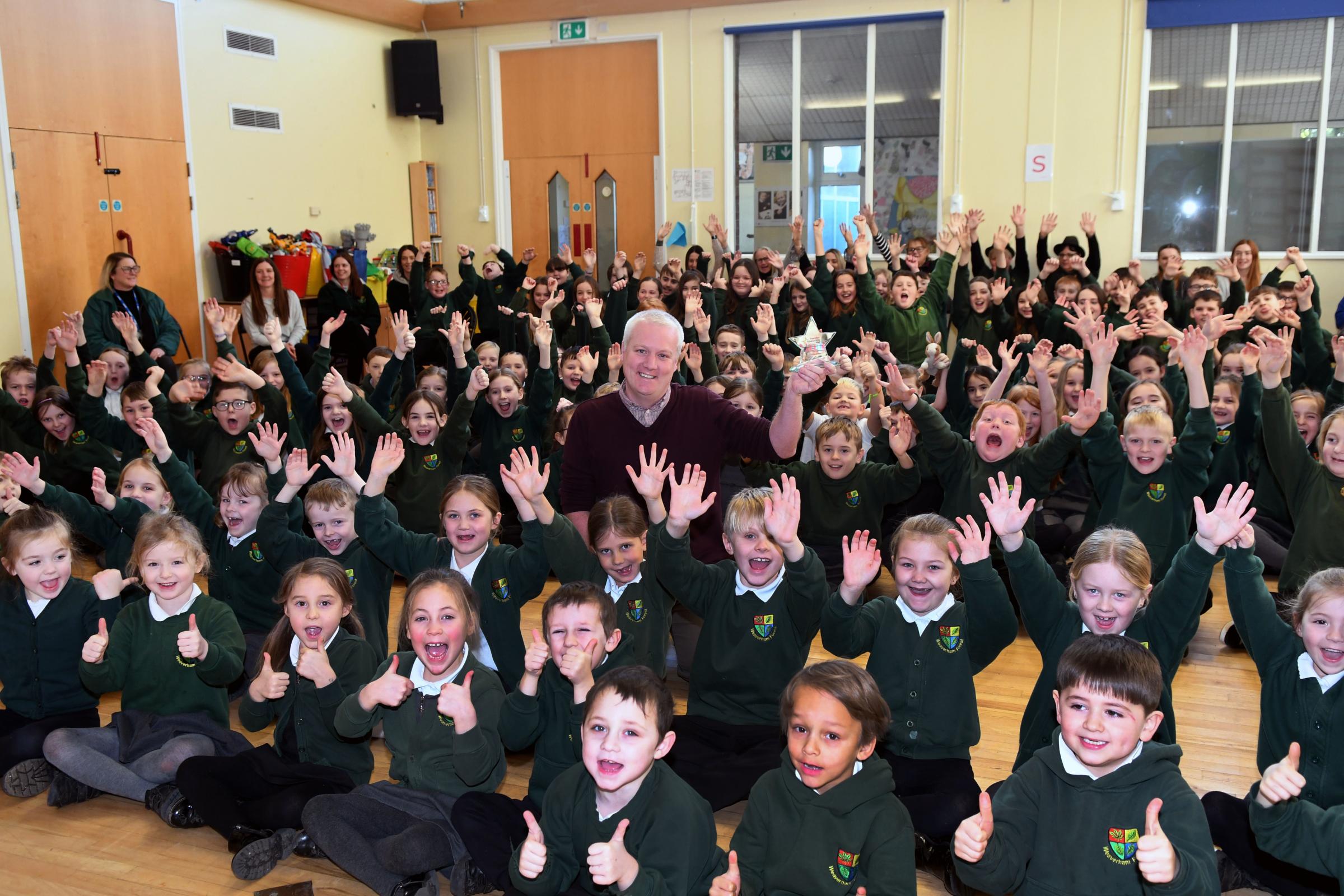 Primary School Teacher of the Year James Proctor celebrates with Weaverham Forest Primary School pupils