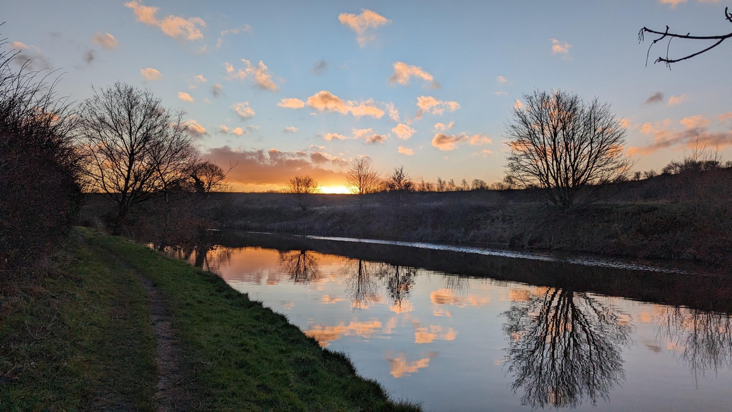 Sunrise and reflections on the river Weaver