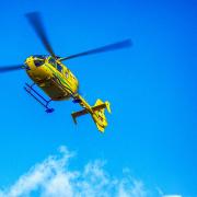 An air ambulance is at the scene of a two-car crash in Oakmere, which has closed Chester Road in both directions