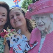 Tracey Egan and Kerry Yardley pose for a picture with a cardboard cut out of the Queen as they raise £700 for St Luke's Hospice