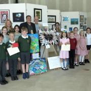 The winning schools received their prizes from Adam Gerrard (Northwich BID) and Phil Carswell of Visual Arts Cheshire