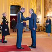 Prince William presents Matthew Lanham with his OBE at Windsor Castle