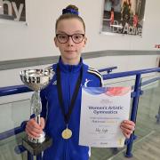 Edie Coyle with her trophy and certificate
