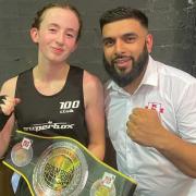 Bella Dempsey receives her belt from an England Boxing offical in Birmingham on Sunday
