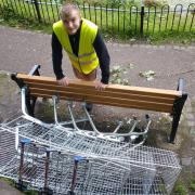 Hundreds of trolleys have been dumped in Winsford Town Park over the past five years. Town Council groundsman Alfie Grayson collects four more on Friday