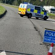 Police at the scene of the A556 sinkhole