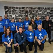 Carol Roberts (front row centre) and some of the team taking on the eight-hour spinathon