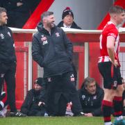 Witton Albion manager Jon Macken, laughing, and his assitant Steve Atkinson, left, at Saturday's game against Stalybridge Celtic