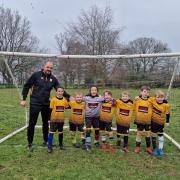 Davenham Juniors U7s sporting mismatched socks for World Down Syndrome Day