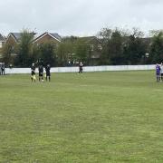 Players from Barnton and Winsford United observe a minute's silence in memory of Winsford forward Ross Aikenhead, who passed away over the weekend