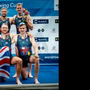 Tom Ford and his Great Britain men's eight crewmates celebrate with their gold medals