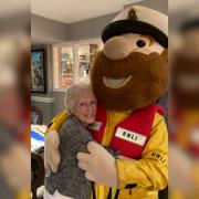 Volunteer of 44 years, Connie Curzon (left) with Stormy Stan, the RNLI mascot, at the Northwich Fundraising Committee's 100th anniversary dinner