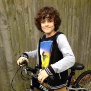 Mackenzie Batey-Gray, 11, on his bike.
