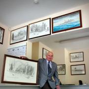 Bill with his paintings