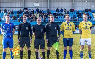 Tom Ellis as Warrington Town's mascot with skipper Mark Roberts, Whitby Town captain Daniel Rowe and the match officials ahead of kick off. Picture by Brian Murfield