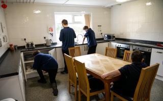 Cloughwood Academy students tidying a kitchen