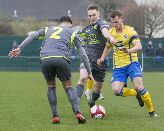 Liam Goulding, right, pictured in action against Witton Albion for Warrington Town during a Northern Premier League fixture. Picture: John Hopkins